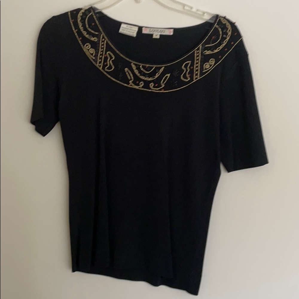 Cute top with decorative neckline